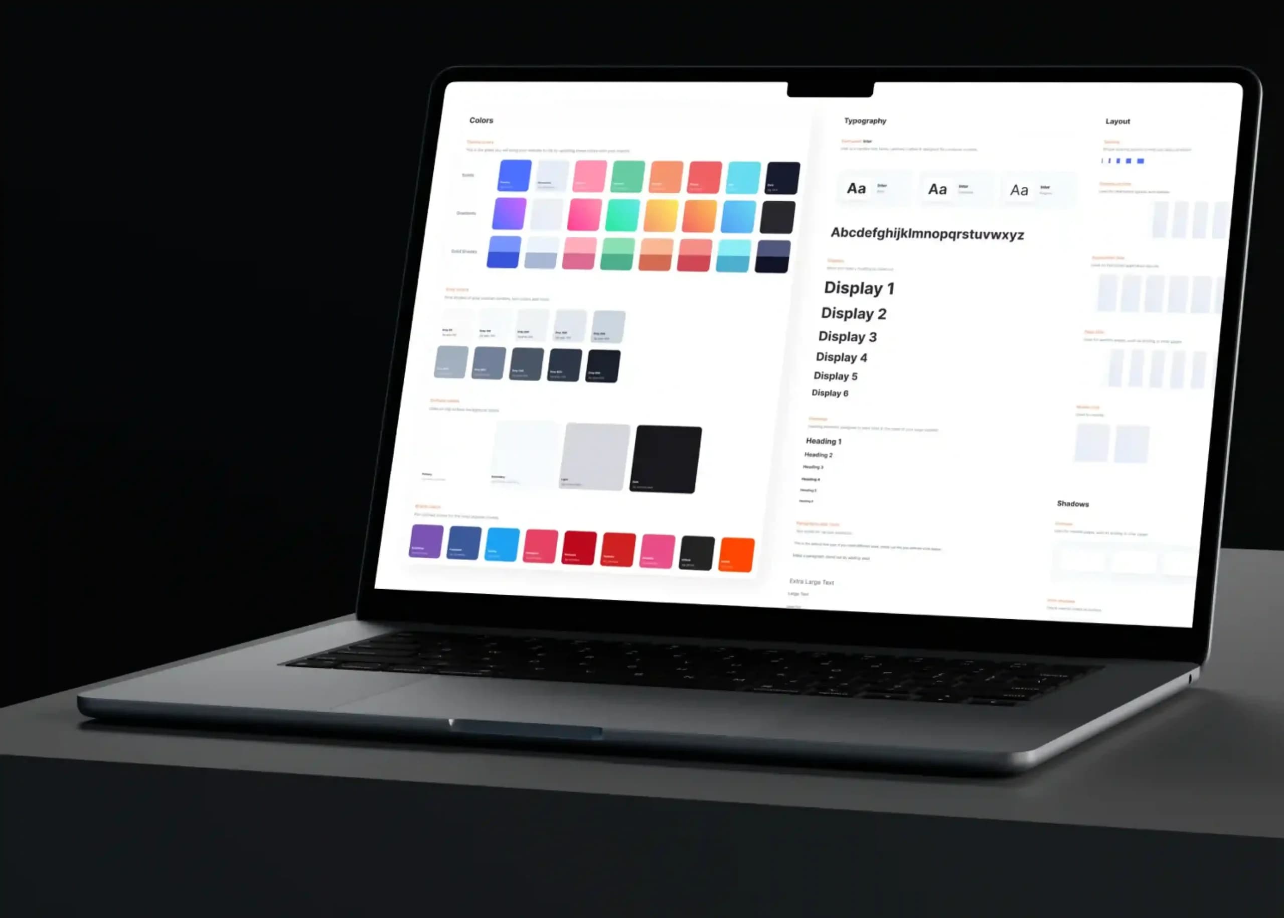 Laptop displaying an enterprise design system with color palettes, typography, and UI components, illustrating how strategic color choices build trust and improve B2B conversions.