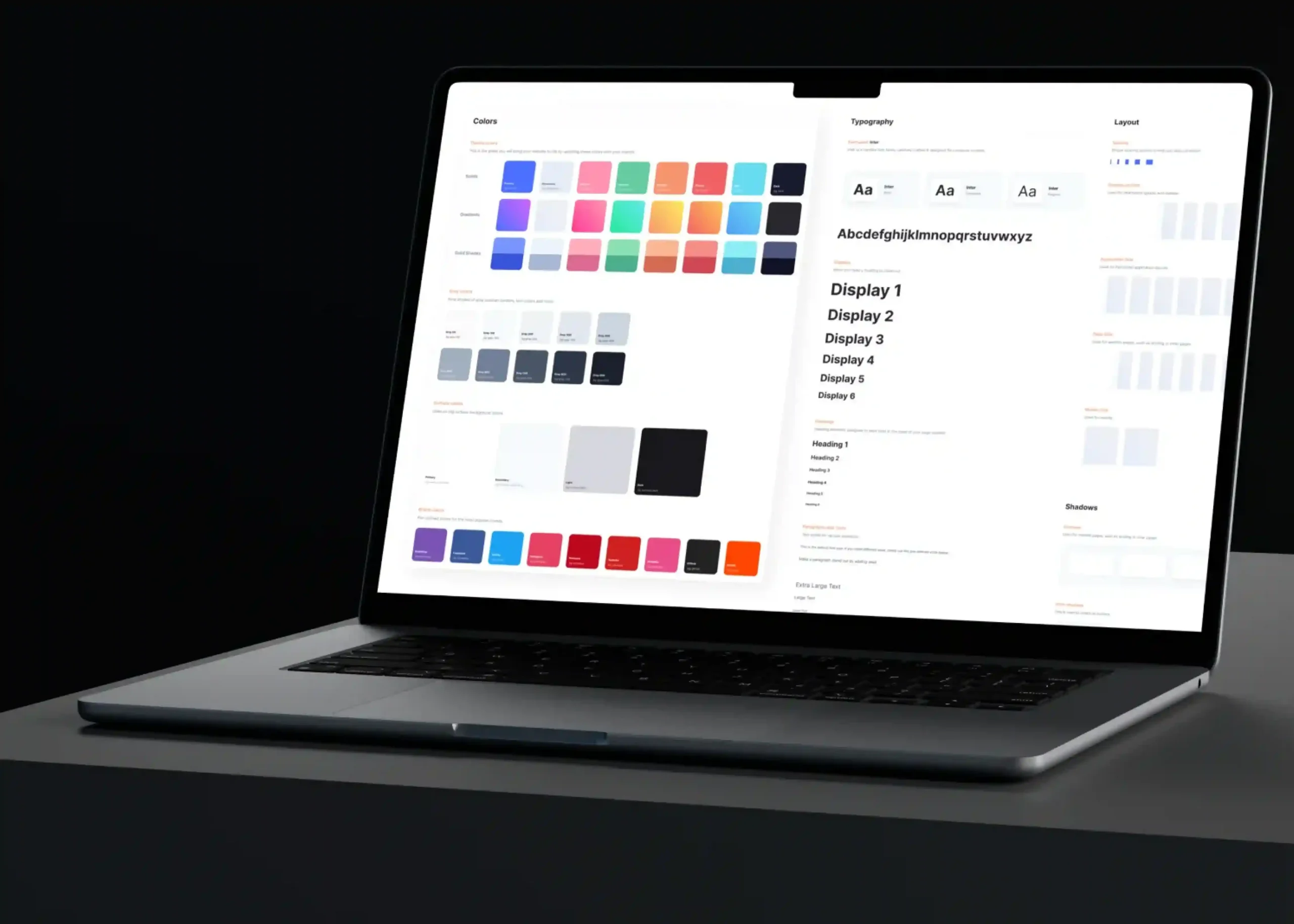 Laptop displaying an enterprise design system with color palettes, typography, and UI components, illustrating how strategic color choices build trust and improve B2B conversions.